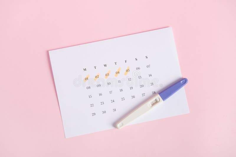 Positive Pregnancy Test Showing Two Stripes on Calendar with the Dates