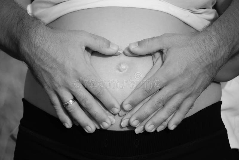 Pregnant Belly With Hands In A Heart Shape Stock Photo - Image of arms ...