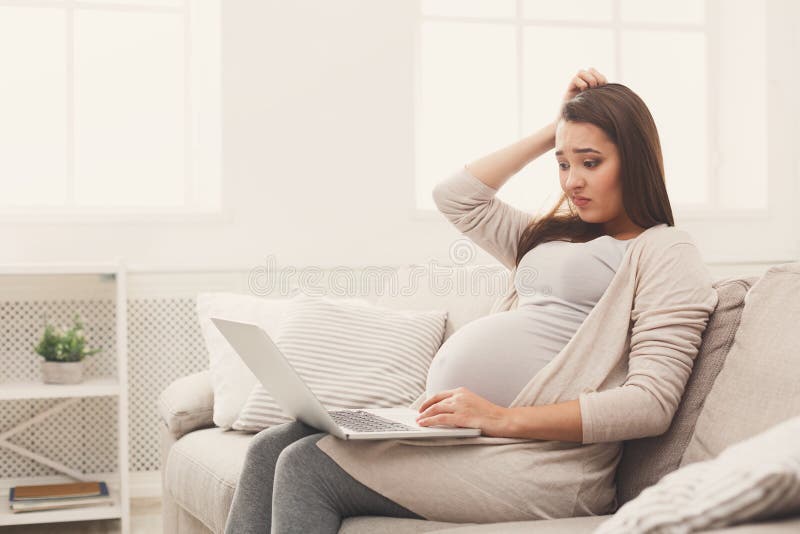 Pregnant business woman remote working at home