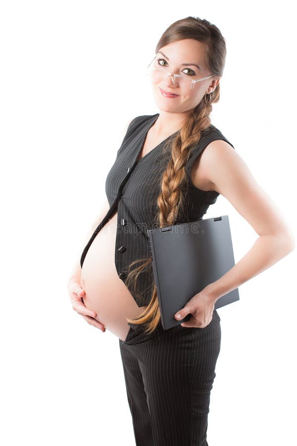 Pregnant businesswoman with laptop at work