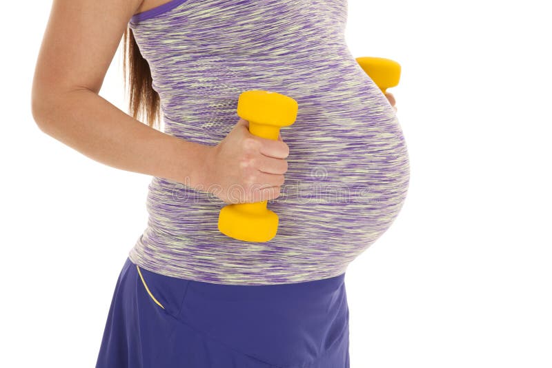 Pregnant close belly fitness weights