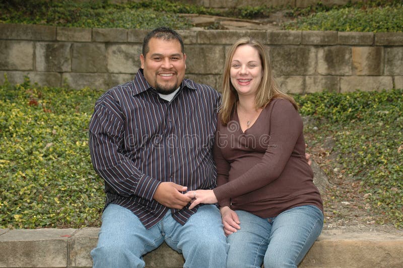 Pregnant Couple. Diverse mixed couple having a baby Pregnant Couple. Diverse mixed couple having a baby