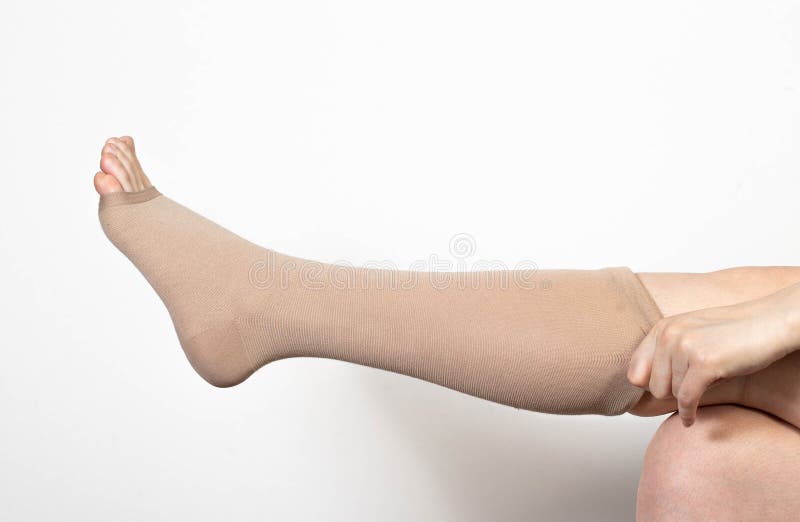 Pregnant Girl Puts on Compression Stockings for Varicose Veins on Her Legs.  White Background Stock Image - Image of chronic, stockings: 267322175