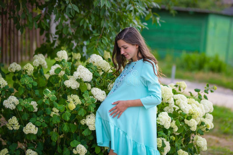 Pregnant Girl In A Turquoise Dress Pregnant Woman In Day Dress