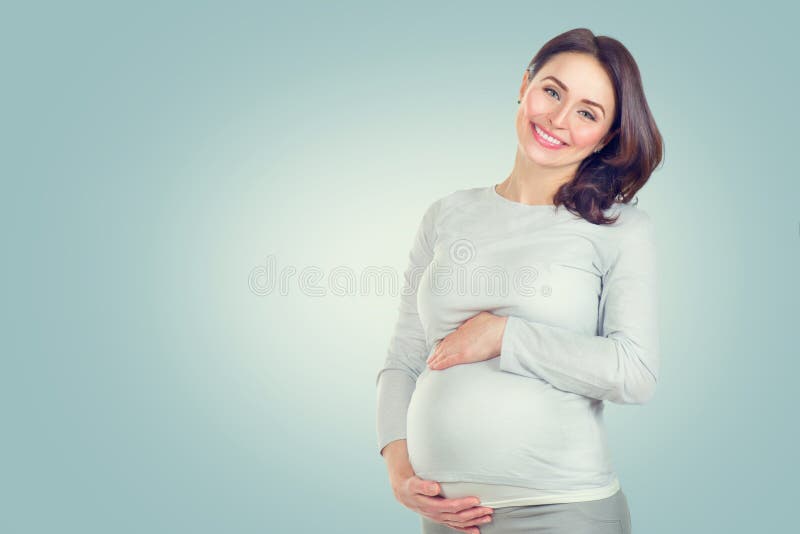 Pregnant happy woman touching her belly. Pregnant middle aged woman portrait. Healthy pregnancy