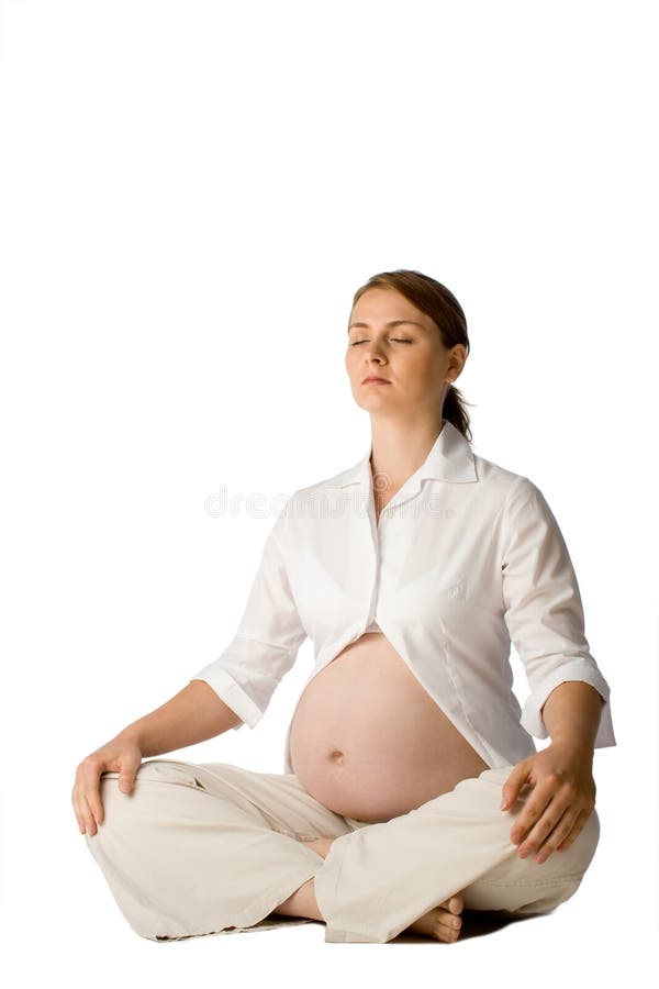 Pregnant lady doing yoga royalty free stock photography Pregnant lady doing yoga royalty free stock photography