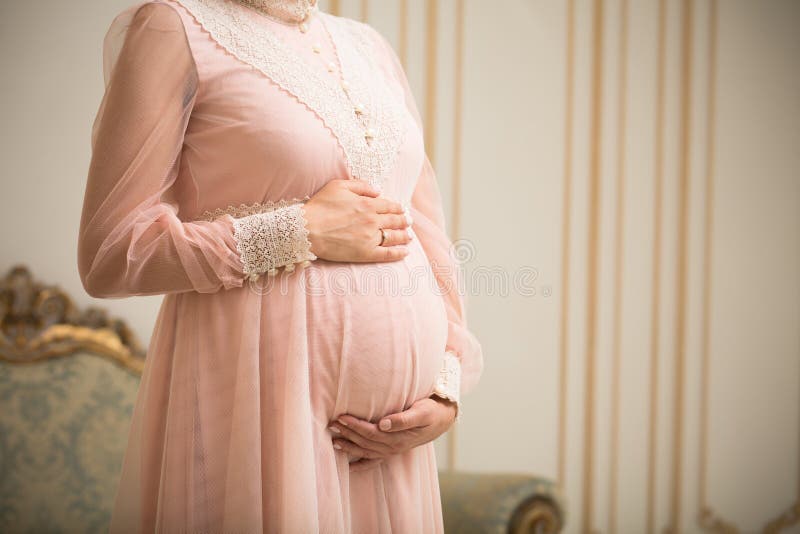 Pregnant lady in vintage interior