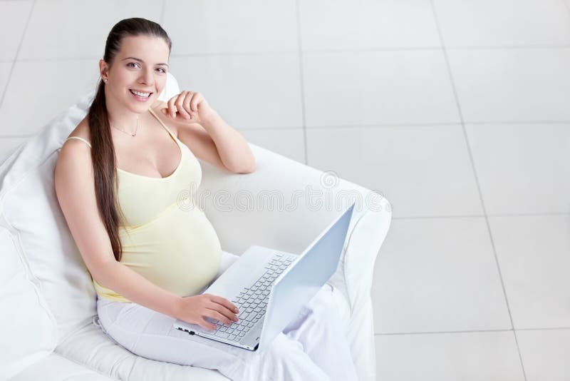 Pregnant with a laptop stock photo. Image of waiting 22501522