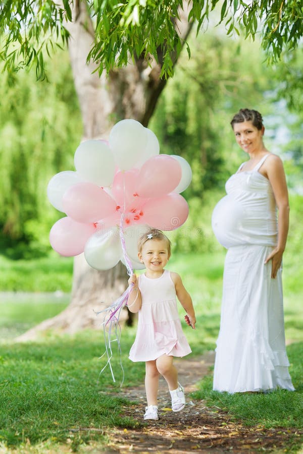 Pregnant mother and her daughter