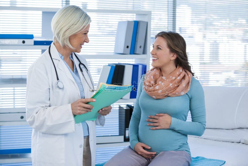 Pregnant patient consulting a doctor stock images Pregnant patient consulting a doctor stock images
