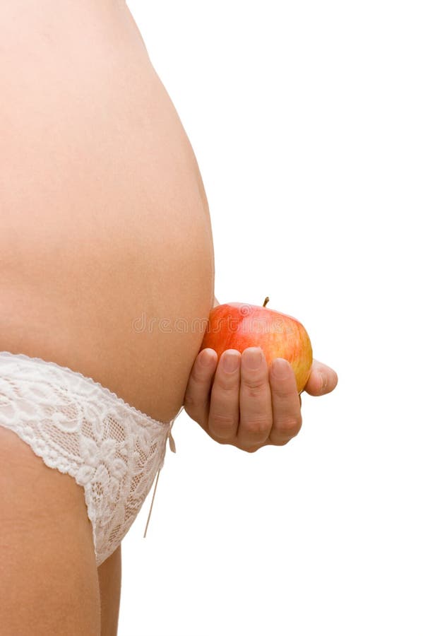 The pregnant woman with an apple royalty free stock photography The pregnant woman with an apple royalty free stock photography