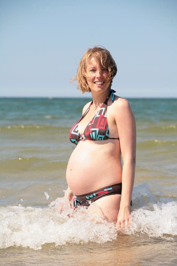 Pregnant woman on the beach