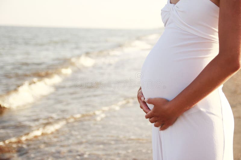 Pregnant woman on the beach