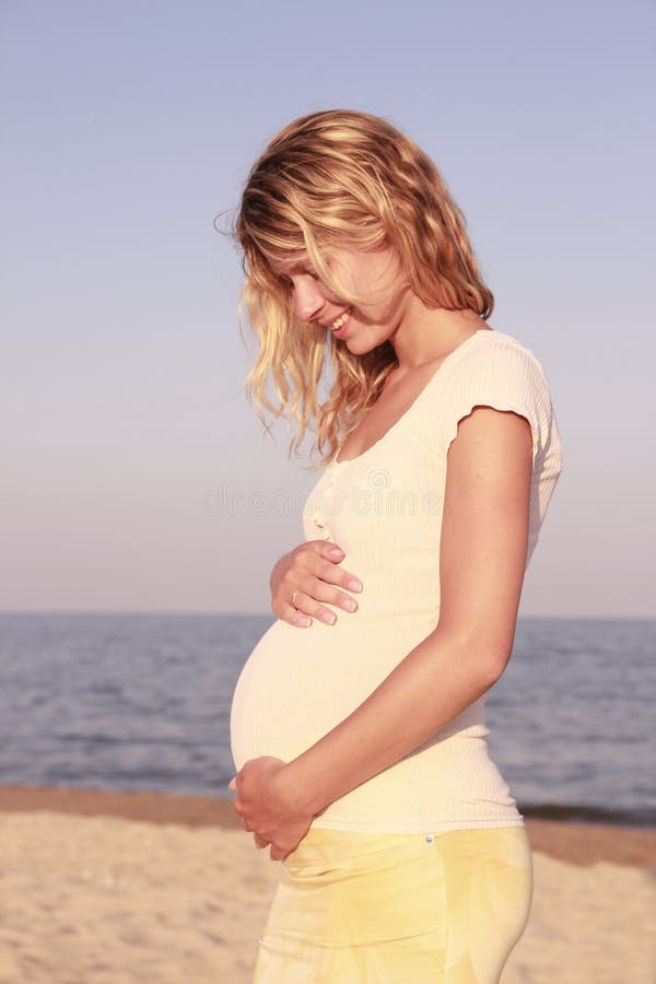 Pregnant woman on the beach