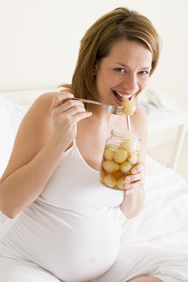 Pregnant Woman in Bed Eating Pickled Eggs Smiling Stock Image Image of family, relaxing 5943203