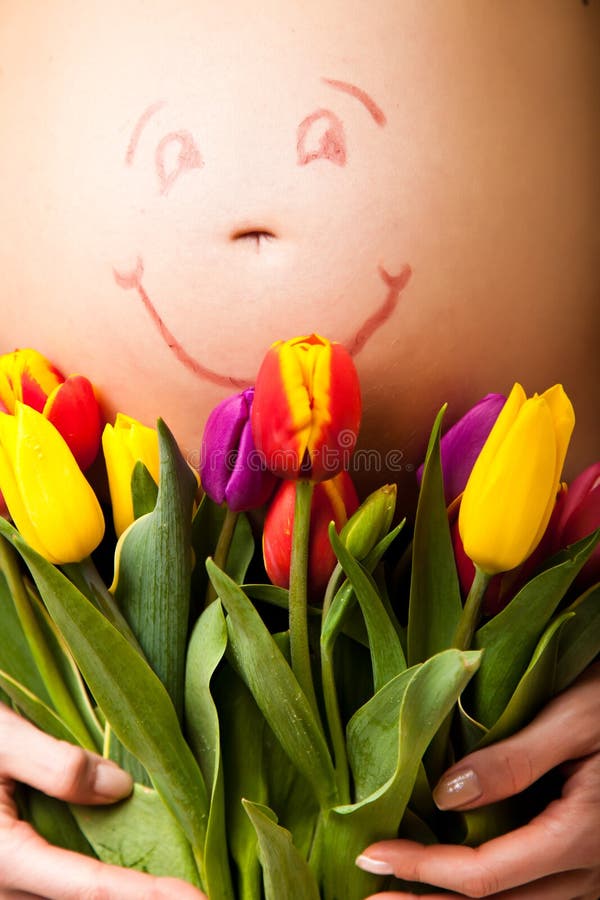 Pregnant woman belly with tulip