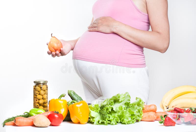 Pregnant Woman Belly With Vegetables And Fruits Stock ...