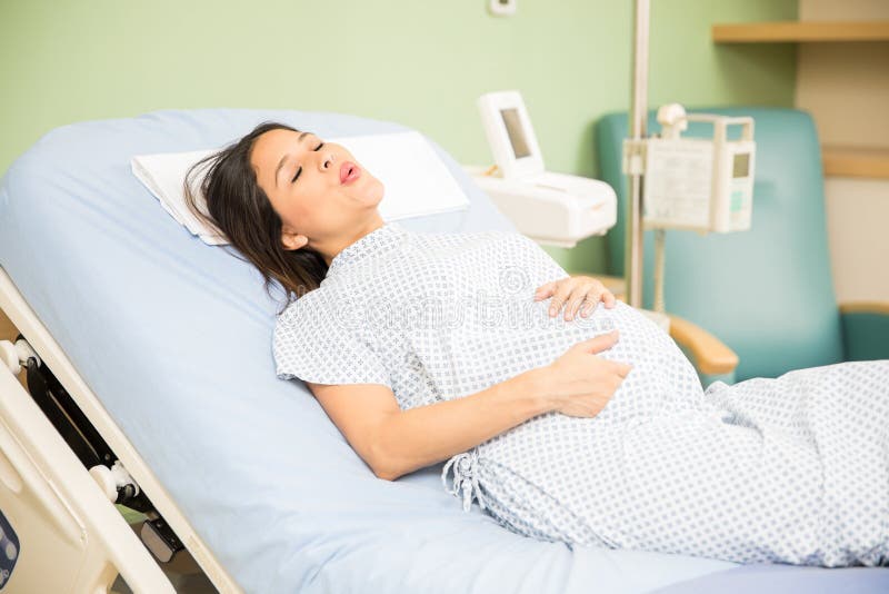 Pregnant woman breathing for the pain