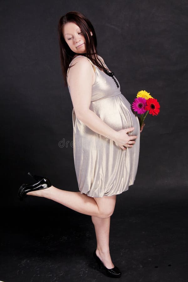 A pregnant woman in a dress