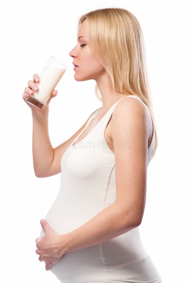 Pregnant woman drinking milk