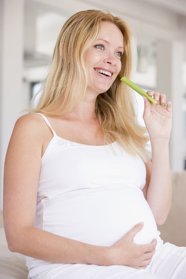 Pregnant Woman Eating Celery and Smiling Stock Photo Image of celery, person 5943586