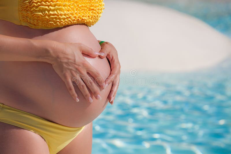 Pregnant tummy bikini picture