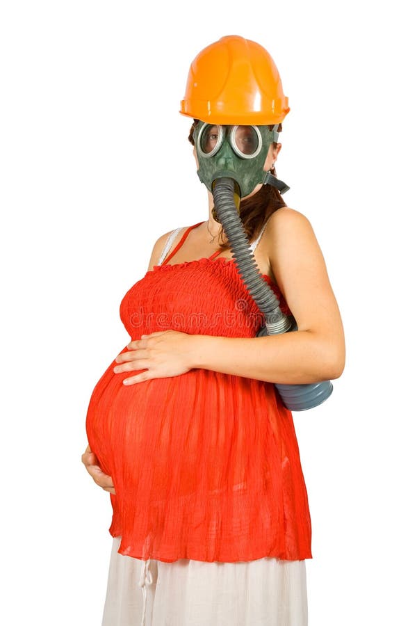 Pregnant woman in hardhat and gas-mask royalty free stock image