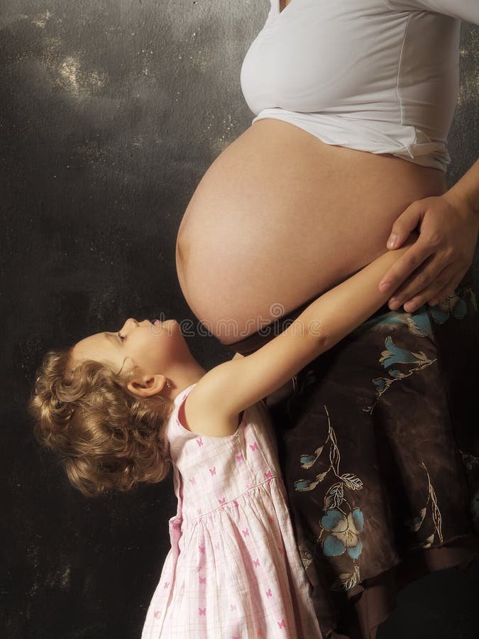 Pregnant woman and her daughter