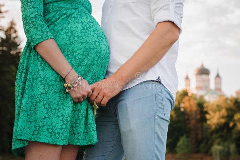 Pregnant Woman And Her Husband In Green Dress Stock Image Image Of 