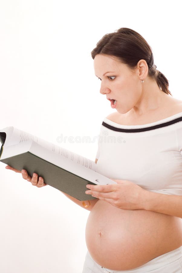 Pregnant woman holding a green book