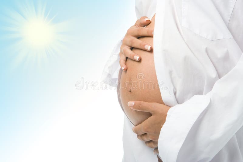 Pregnant woman holding her belly royalty free stock photo Pregnant woman holding her belly royalty free stock photo