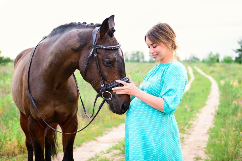 Pregnant woman with horse stock photo. Image of abode 86283674