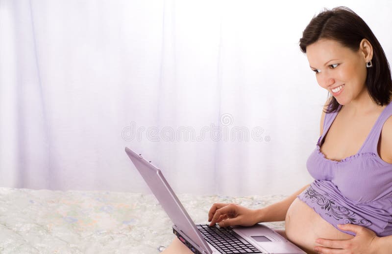 Pregnant woman with laptop