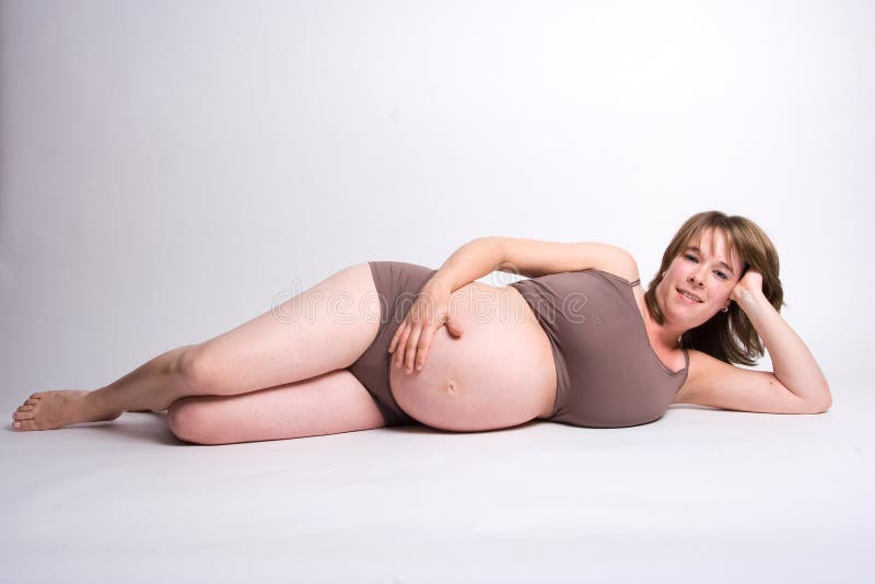 Pregnant woman lying on the floor