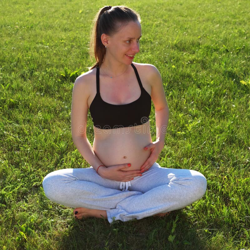 Pregnant woman outdoors. 