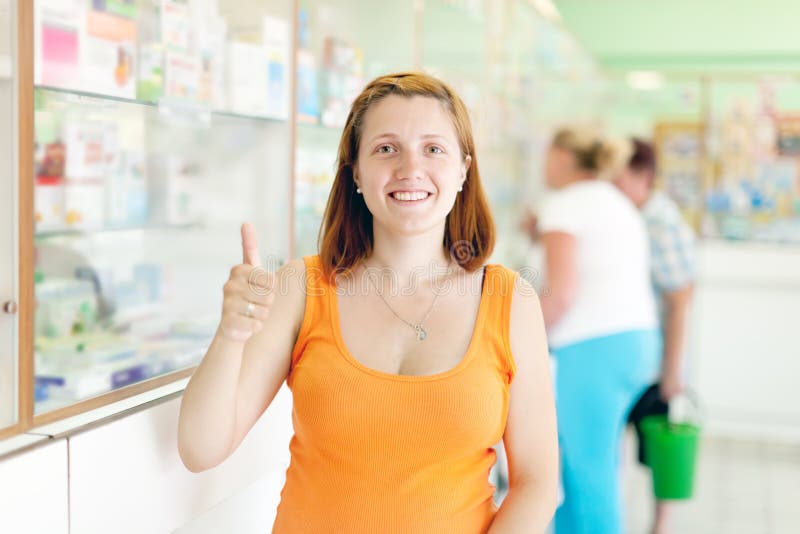 Pregnant woman at pharmacy royalty free stock image