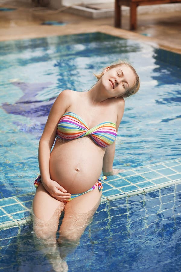 Pregnant woman in the pool