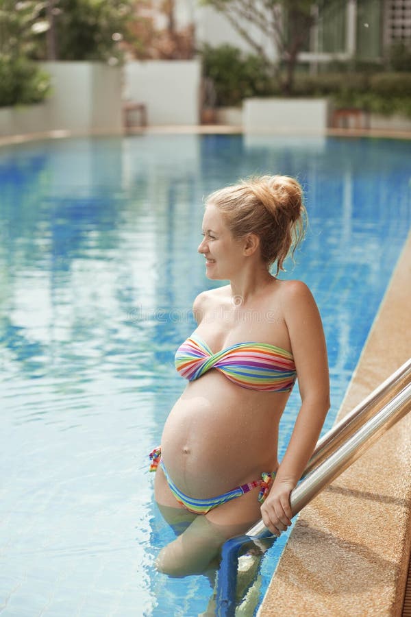 Pregnant woman in the pool