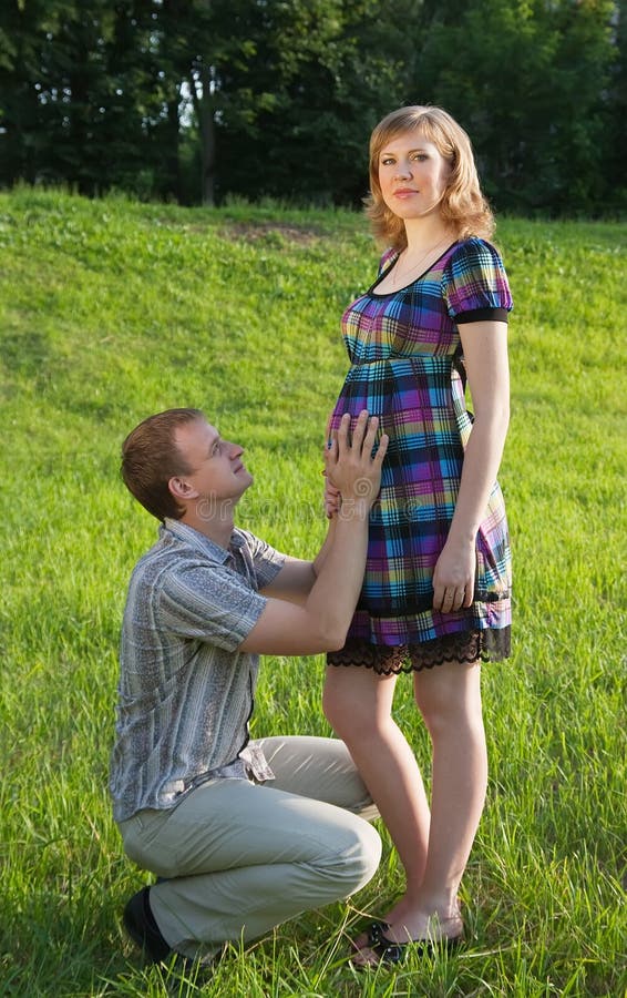 Pregnant Woman Poses with Her Husband Stock Image - Image of