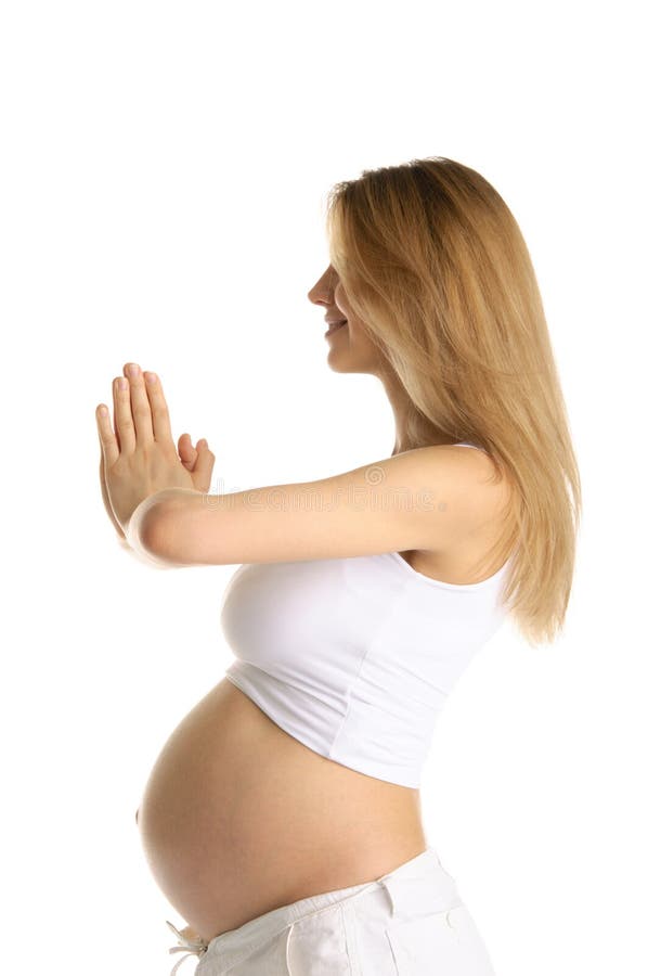 Pregnant woman practicing yoga