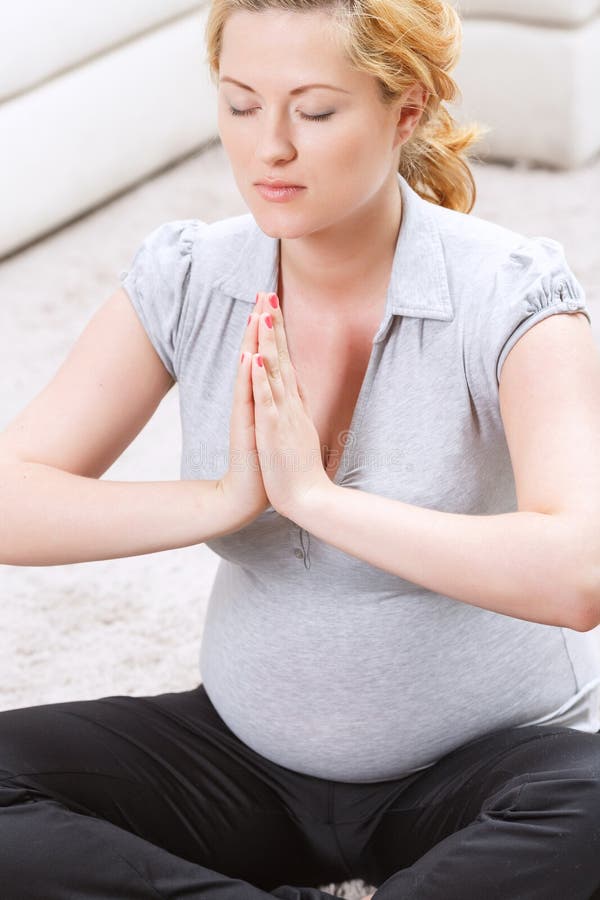 Pregnant woman practicing yoga stock photos Pregnant woman practicing yoga stock photos
