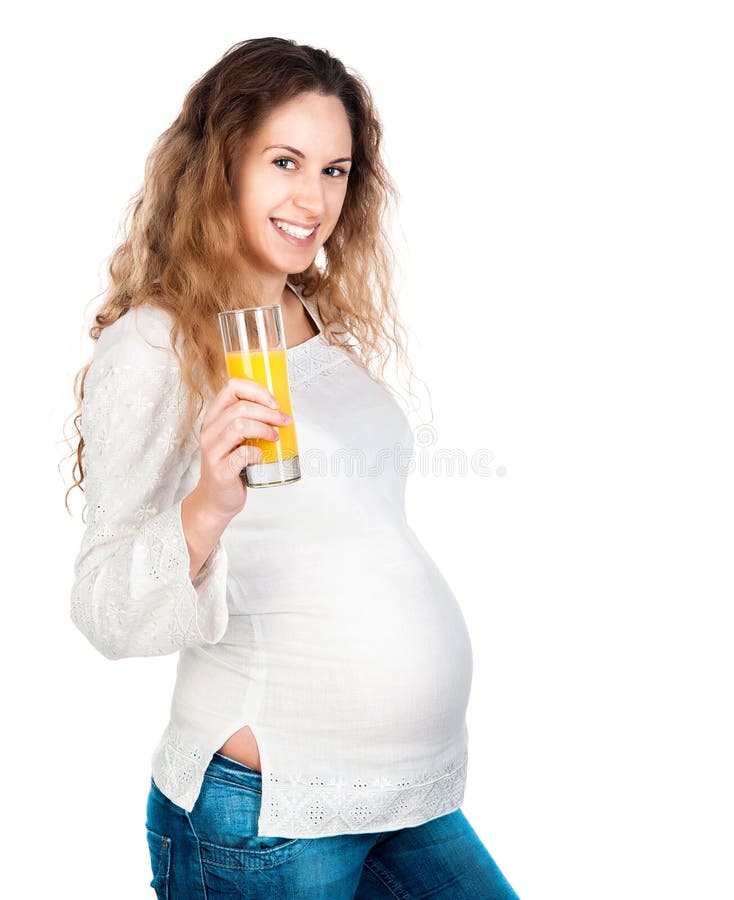 Pregnant woman with pretty stomach holding orange