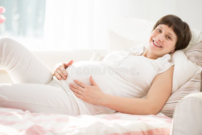 Pregnant woman relaxing stock photo. Image of gravid 55751548