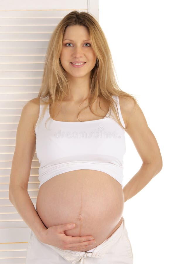 Pregnant woman standing near the door