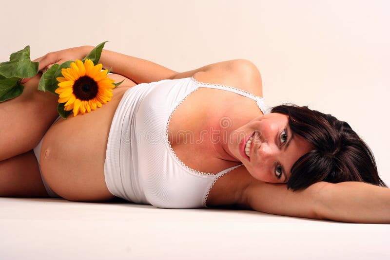 Pregnant woman with sun flower