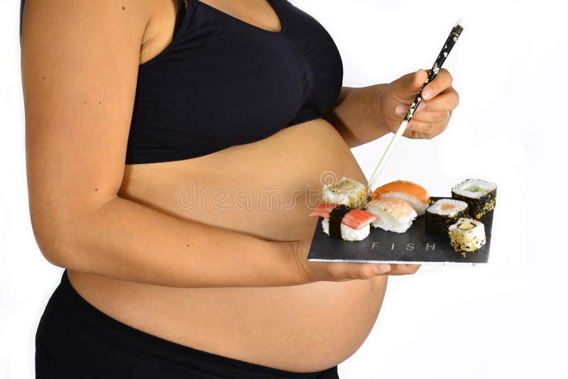 Pregnant woman with sushi