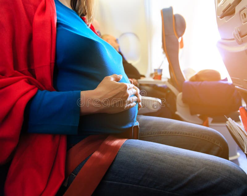 pregnant woman travel on a plane