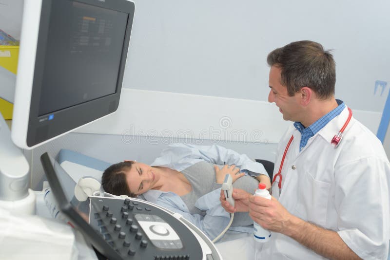Pregnant woman on prenatal ultrasound stock photo Pregnant woman on prenatal ultrasound stock photo