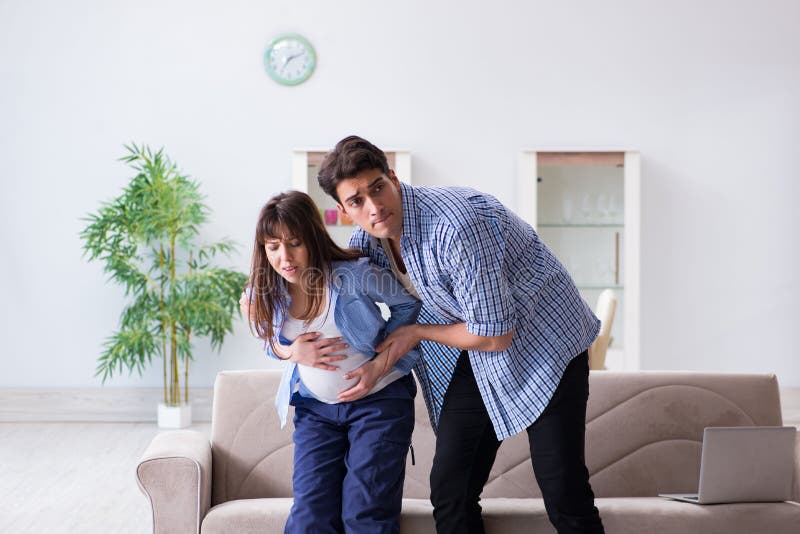 The pregnant woman with husband at home