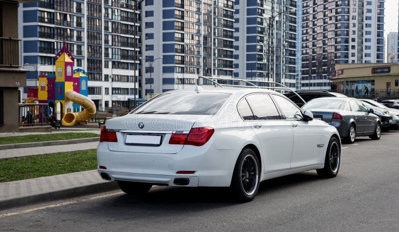 Minsk, Belarus, May 3, 2024 - Premium car business BMW in city. White sedan
